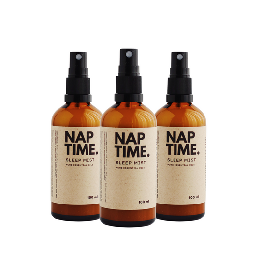 The image features Australia’s Best all-natural sleep spray, “Nap Time”. It includes three 100 ml bottles of sleep mist with spray nozzles.  The Product is labelled with a minimalism design, containing pure essential oils designed to promote better sleep naturally.