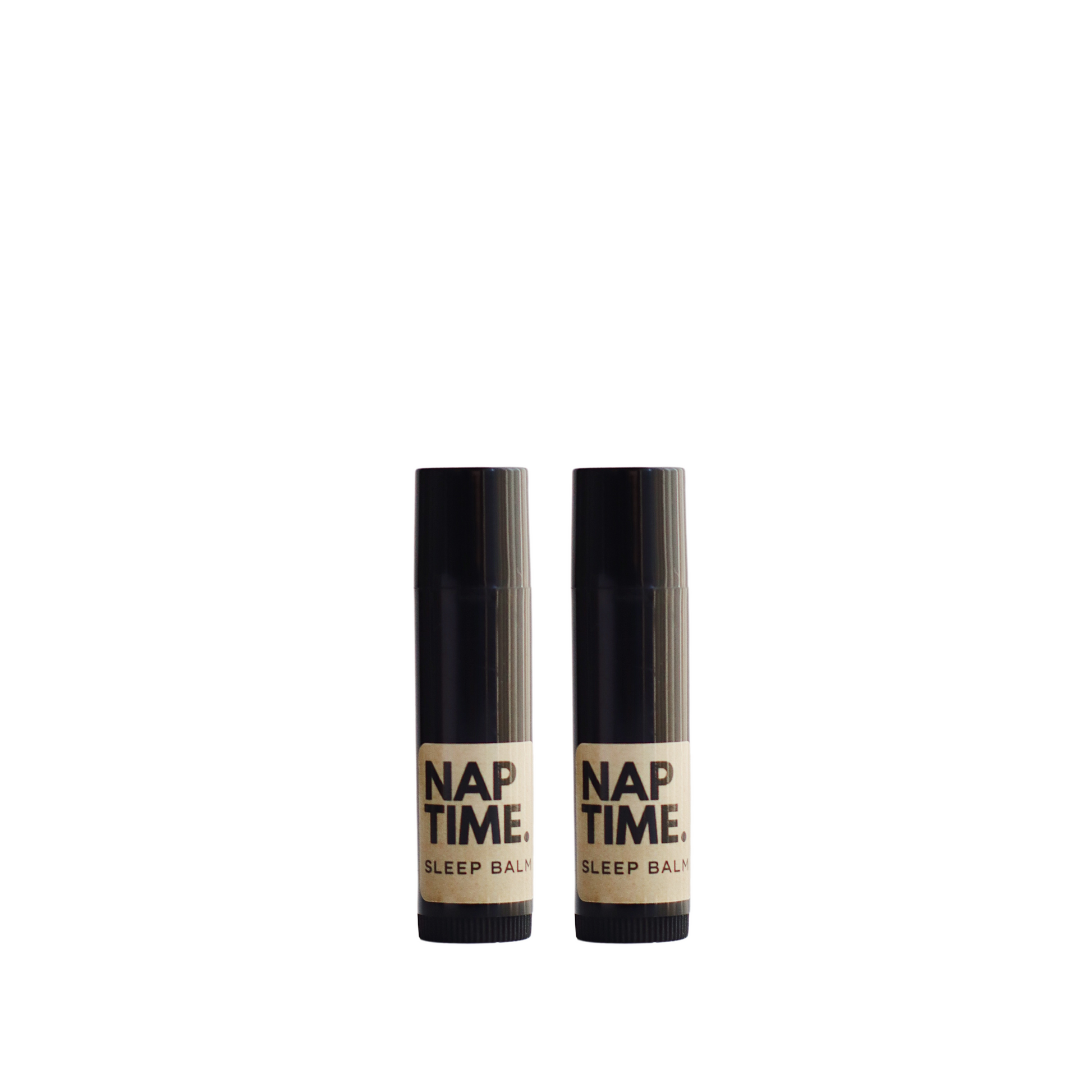 The image displays two identical cylindrical tubes of a product labelled “Nap Time Sleep Balm.” The tubes sleek design each with a black body and cap which gives the product a modern and unisex appeal. The label on each bottle has a minimalist design with a beige background and black lettering, clearly stating the product name and its designation as a sleep balm. 